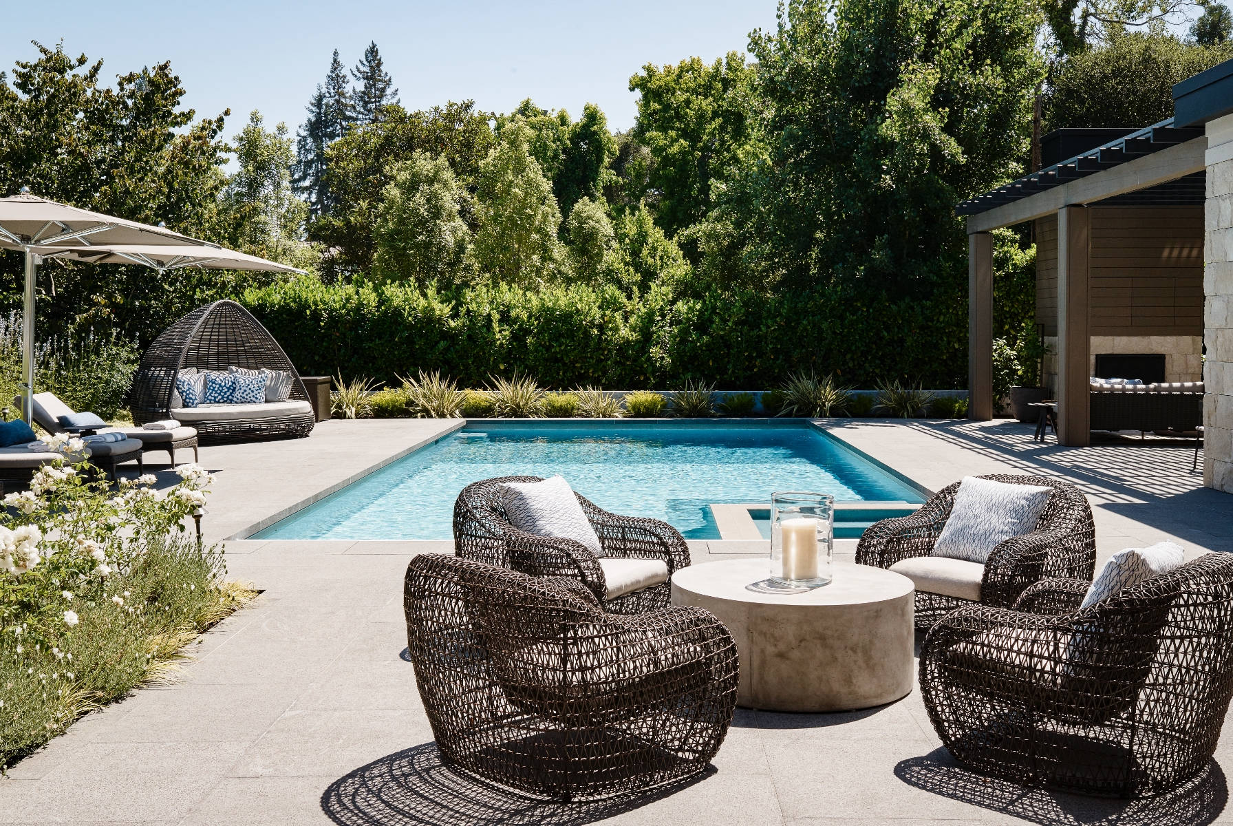 Outdoor pool, with seating area and umbrellas.