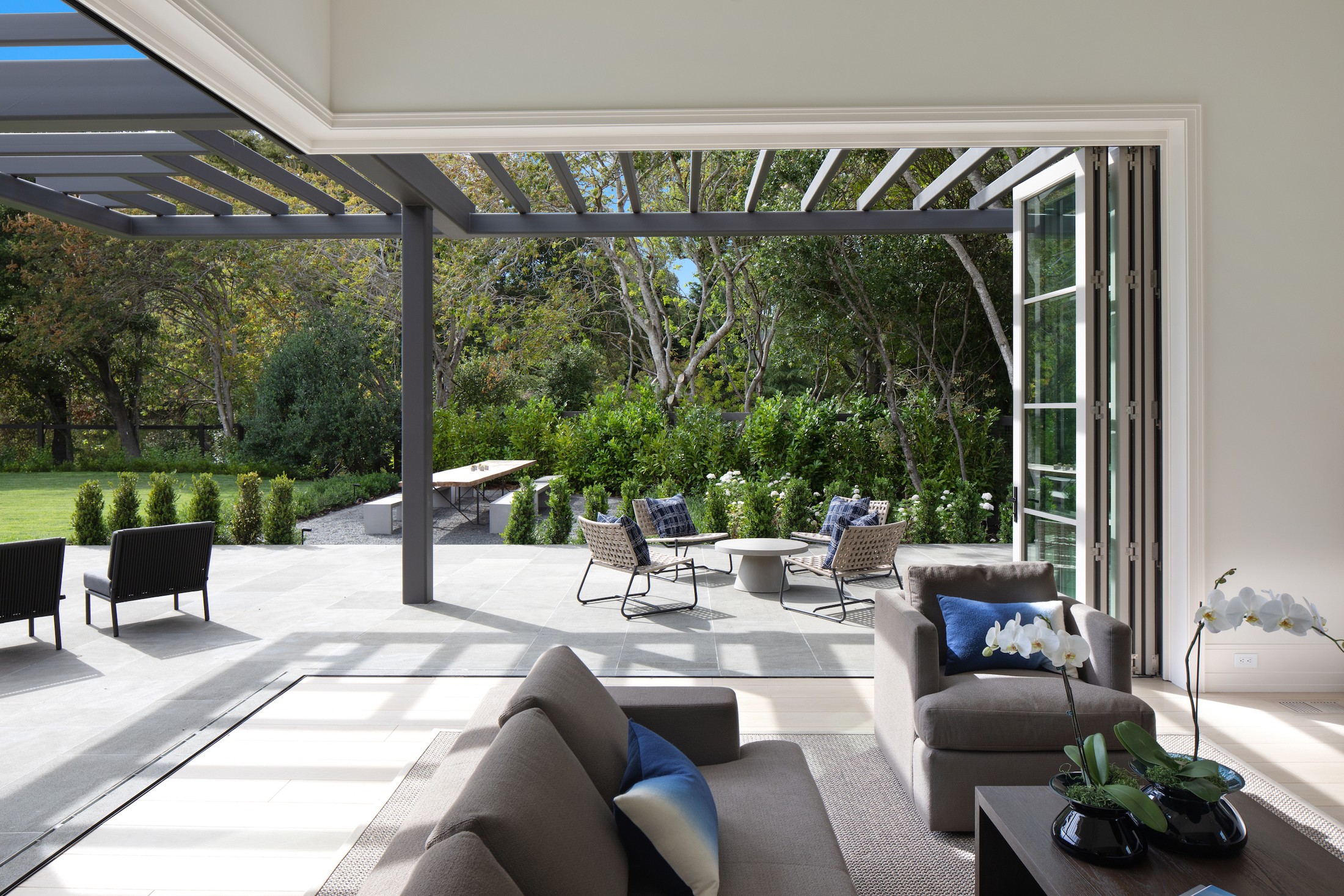 Outdoor patio with multiple seating areas.