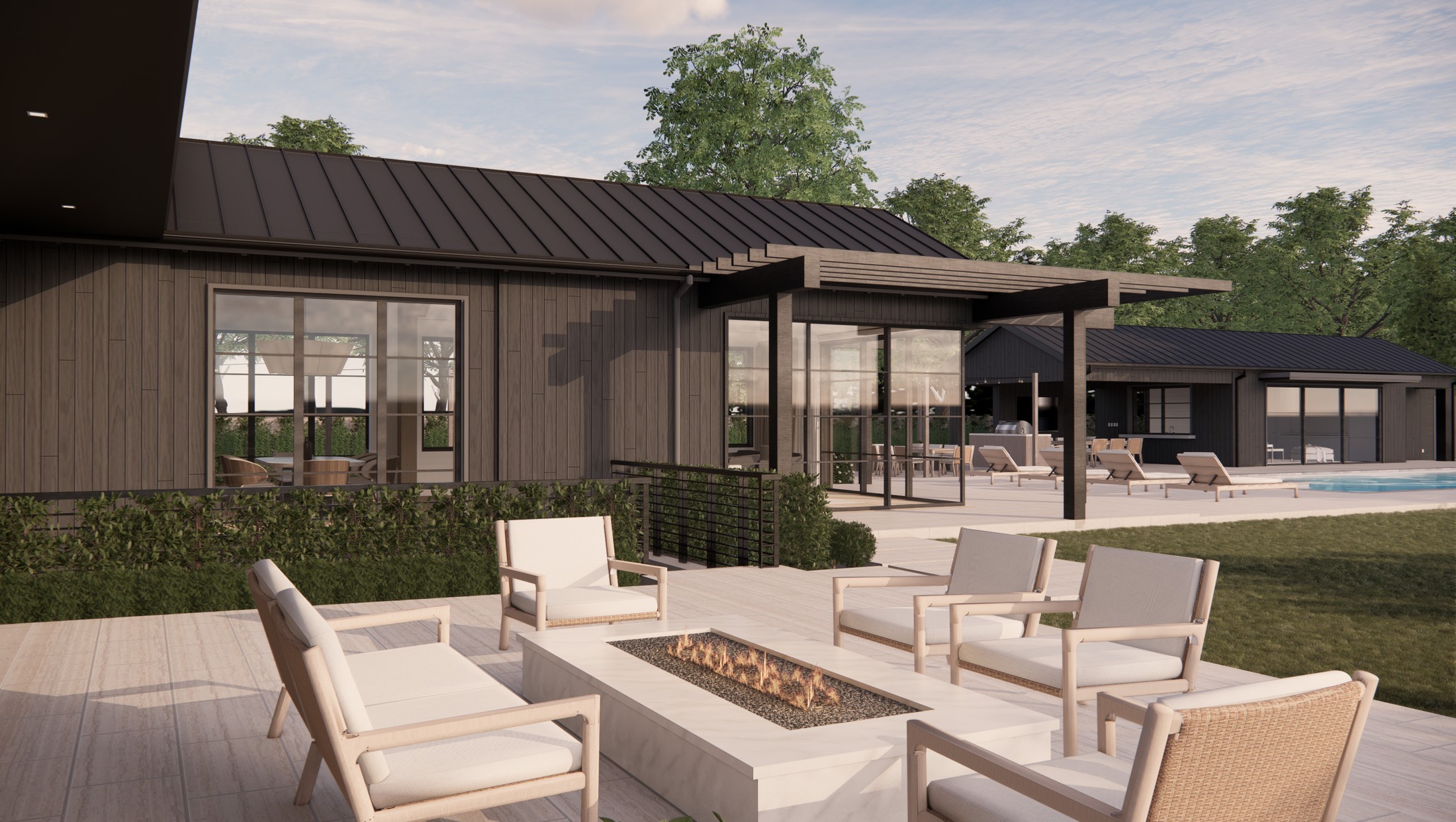Close up rendered image of one of the outdoor spaces in the home, which has white chairs and a firepit.